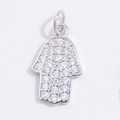 Macro shot of a Hamsa hand pendant with S925 silver finish and shimmering zircon stones - White Gold Hamsa Hand Pendant