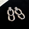 Detail of silver drop earrings with hammered texture and shimmering zircon inlay - Silver (Silver Pin)