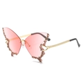 Detail view of pink butterfly rimless sunglasses featuring brown rhinestones and gold temples - Gradient Pink