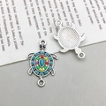 Antique silver sea turtle charms with colorful beads on a text-printed paper background - 1Pc White K Enamel Color Rhinestone Turtle 16*25mm