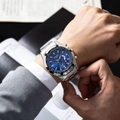 Close-up of luxury chronograph watch with blue dial on a man in a business suit - Silver Strap Blue Dial