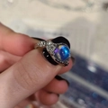 Vintage silver snake ring featuring a round blue-purple iridescent gemstone in a macro view - Retro Moonstone Style - Silver