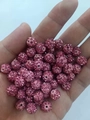 Pink rhinestone Shamballa beads for DIY jewelry held in hand for size visual - Rose Red