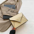 Cream envelope shoulder bag with silver V-shaped hardware and fine chain strap - Gold