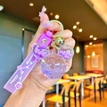 Purple Mickey-shaped liquid glitter keychain with silicone wristband and golden bell accessory - Purple Luminous Mickey Head