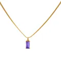 Macro shot of gold snake chain with a rectangular purple zircon pendant and metal texture - Purple Zirconia - Gold Plated
