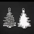 Set of two antique silver Christmas tree metal pendants with star detail on black background - Christmas Pine / Antique Silver
