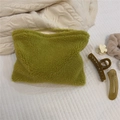 Macro detail of grass green fuzzy fleece makeup bag showing soft plush texture and zipper - Matcha Green