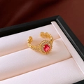Detail of 18K gold-plated bow ring with ruby red gemstone in a beige jewelry box - Pink Heart Zirconia Opening Ring (30#)