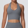 Detailed view of seamless grey halter neck sports bra with plunging V-neckline and wide hem - Dark Gray