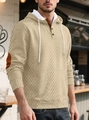 Detail eines beigen Kapuzenpullovers mit Rautenmuster, Knopfkragen und Ellenbogen-Patches - Khaki