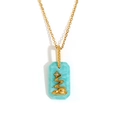 Collana in acciaio placcato oro 18K con pendente rettangolare turchese e motivo ad albero - Stile Acqua Corrente
