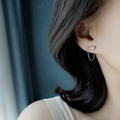 Elegant silver heart threader earrings in stainless steel on a model showing minimalist style - Heart Ear Thread Steel Color / Steel
