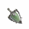 Macro view of vintage silver thorn frame with green teardrop labradorite pendant - Aventurine Jade