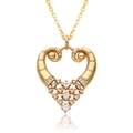 Detailed close-up of 18k gold plated heart pendant with zircon inlay and mirror reflection - Hollow Scroll Pattern Heart Style (c554)