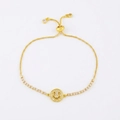 Close-up of golden adjustable slider bracelet featuring a crystal-encrusted smiley charm - Gold Pull Chain - Full Zirconia Smiley