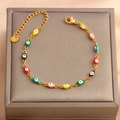 Detail of colorful evil eye enamel charms on a gold stainless steel adjustable bracelet - Multicolor Small Eyes