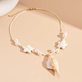 Bohemian pearl necklace featuring a natural conch shell and starfish beads on a beach cord - White Conch
