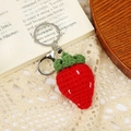 Handmade crochet strawberry keychain in red yarn with green leaves and silver metal ring - Big Strawberry