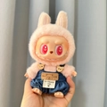 Pink plush doll Labubu wearing dark blue denim overalls with bear buttons - Fussy Jeans / First And Second Generation Keychains Are Compatible With La Cloth Dolls. Dolls Not Included.