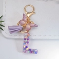Chic purple letter L keychain with snowflake sequins, butterfly charm and suede tassel - Letter L