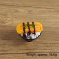 Realistic Tamago Sushi toy model with yellow egg and rice in a black bowl on wood table - Tamagoyaki Sushi - No Hook / 5CM Diameter