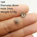 Detailed macro view of 8mm silver flower bead caps for DIY jewelry making - Style 14