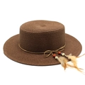 Close-up of woven straw sun hat featuring a delicate feather charm and beaded trim - M (56-58cm) / Brown