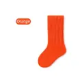 Single orange mid-calf cotton sock for kids featuring thick vertical ribbed texture style - Orange