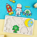 Space themed silicone mold featuring astronaut, rocket, and stars for creative cake baking - Gray