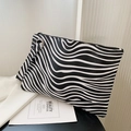 Minimalist zebra print envelope clutch bag in black and white with wristlet strap - Zebra Fine Print