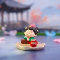 Charming Tang Dynasty lady tumbler figurine in red and green attire reading on a leaf base - Tang Dynasty Lady Series / Reading (1056-25)