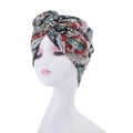 Detail of bohemian turban hat featuring a classic paisley print and front twist design - Style 17-Multicolor Paisley Texture Knot