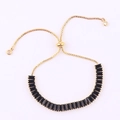 Adjustable gold-tone tennis bracelet with black rectangular cubic zirconia stones - Slider Clasp Gold-Black