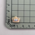 Detailed close-up of a mini 1.5cm resin cupcake charm with colorful sprinkles and eyes - 06*Flower Bread Mini