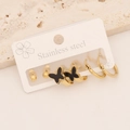 Detailed view of three pairs of gold stainless steel earrings on a white display card - 5# Butterfly