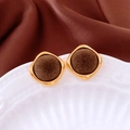Detailed view of vintage gold-framed dark brown flocked square stud earrings on ceramic - Coffee