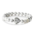 Natural white howlite beaded bracelet featuring round stones and a central heart charm - Howlite