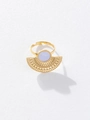 Golden fan-shaped hollow ring with lavender gemstone inlay on white textured background - Ring