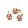 Three gold bezel round pendants with pink faceted stones on a clean white background - 10 Pieces per Pack / Gold Border Pink Stone