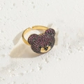 Golden open bear ring with dark red zirconia stones on white stone surface - Adjustable / Rose Red