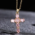 Gold cross pendant necklace featuring elegant pink zircon stones on a dark textured background - Gold Pink Gemstone Cross (款式1)