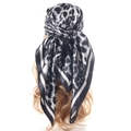 Leopard print satin headscarf in black and white tied on a model for an elegant look - Leopard Print Grey