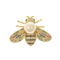 Detailed macro view of a golden bee brooch with colorful crystals and a white pearl - Pearl Colorful Stone Bee