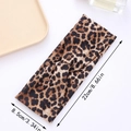 Elastic leopard print knotted headband for women with 22x8.5cm size dimensions - Leopard Cross Style B