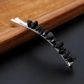 Macro detail of natural black crystal stones set on a silver metal hair clip - Obsidian with Silver Clip