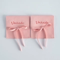 Pink microfiber suede jewelry pouch with ribbon bow and elegant brand logo printing - Pink