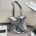 Close-up of velvet tote bag featuring scattered pearl beads and a vertical stitched pattern - Gray