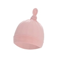 Pink knitted cotton newborn baby hat with decorative top knot on white background - Pink Hat