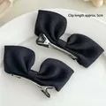 Set of two black bow hair clips with silver metal duckbill base for women hair styling - Black Fabric Bow Hair Clip Pair